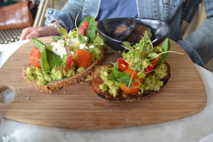 Chunky avocado & Persian feta with fresh chilli, mint & blistered cherry tomatoes on seeded toast