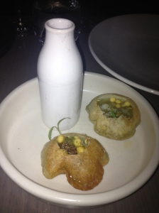 Pani puri, crispy parcel filled with spiced potato, mung beans, date and tamarind chutney with aromatic water