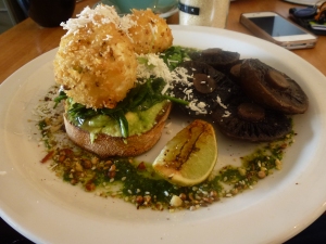Dukkah Crusted Eggs, roasted mushrooms, avocado on sourdough with grilled lime and ricotta.